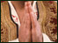 Hands together in attitude of prayer
