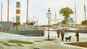 Hand-tinted view of Alloa Harbour, showing men in late Victorian dress standing with a dog on the quayside. A mix of engine powered boats and sailing vessels are moored behind.