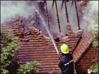 Fireman putting a house fire out