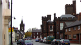 Colour view along High Street, Kirkcudbright, showing the Tolbooth and the County Building.