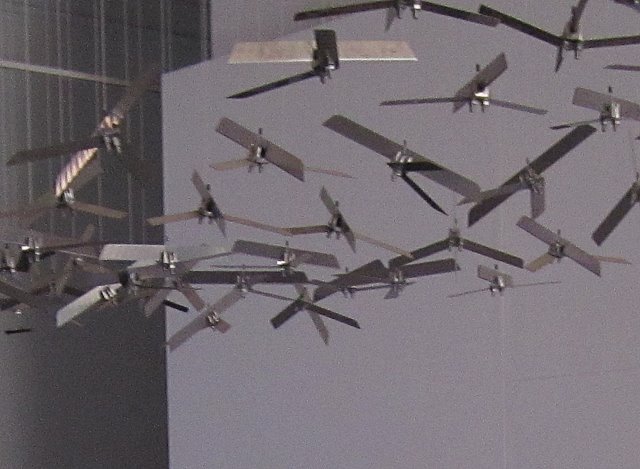 'Flying Carpet of Drones' (detail) by Abdullah Syed. It's a mobile of sixty-one drones (no significance to that number) made of blades from box-cutter knives, like the knives allowed through security and onto the planes that were flown into the World Trade Center in New York in 2001.