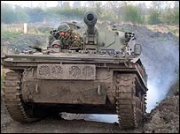 BBC Leicester's Rupal Rajani driving a tank with her instructor on her tank challenge 
