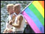 John and Roger- a couple with their Gay Pride flag