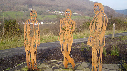 Sculptures of Richard Burton on right, rob Brydon in the middle and Richard Wagstaff on the left.