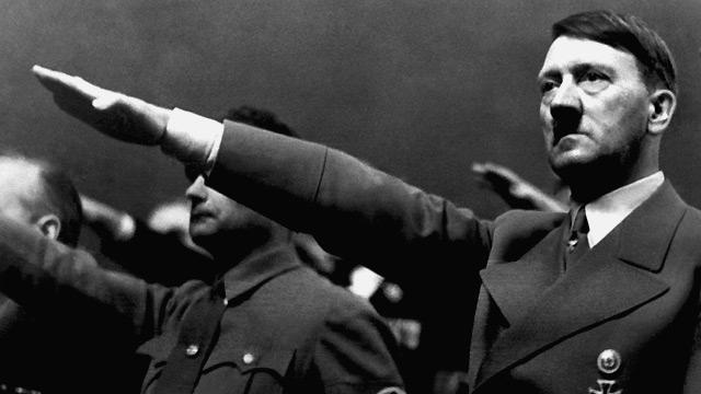 Adolf Hitler giving the Nazi salute during a rally in 1939.