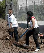 Gail and helper shovelling