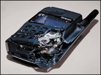 An image from one of the BBC World adverts, featuring a destroyed mobile phone
