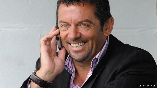 Phil Brown chats on his phone