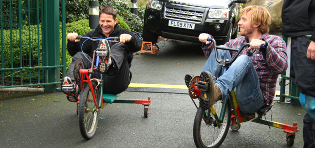 Steve Backshall with Chris from the Production Team riding squirrel bikes