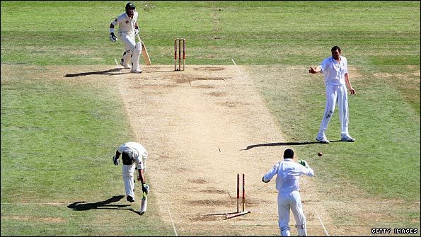 Ricky Ponting (bottom of picture) is run out by a direct throw by Andrew Flintoff (not shown)