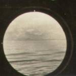 View out of Port Hole from ships Office. (Hawaii in background).