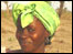 Gambian woman wearing lime coloured headdress