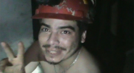 A frame grab shows one of the 33 miners trapped underground in a copper and gold mine at Copiapo, about 725 km (450 miles) north of Santiago