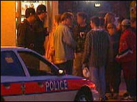 Police questioning a group of teenagers