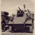 Resting on top of a Humber in the Western Desert