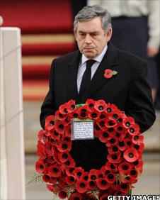 Gordon Brown holding poppy wreath at the Cenotaph