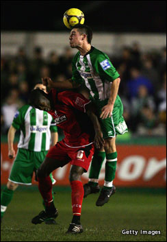 Jamie Poole of Blyth wins the ball from Marvin Bartley of Bournemouth. Photo: Getty Images Sport