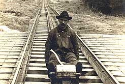 A railroad track inspector checks the track of the White Mountains Railroad 