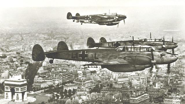 Messerschmitt Me 110s fly over the Arc de Triomphe in Paris, 1940.