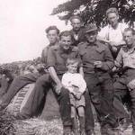 Patrick Barrett with Willy Reuter (immediately behind Patrick) and other PoWs at Upper Hill Farm, Prestbury in 1947 or 1948