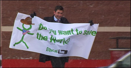 Justin in Muskegon with 'Do you want to save the World' sign