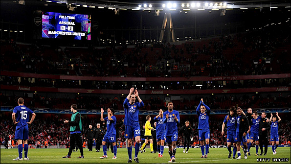 Manchester United's players applaud their fans after the crushing win at the Emirates