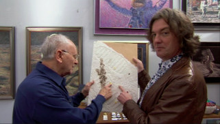 Apollo astronaut Alan Bean shows off his artwork to James May
