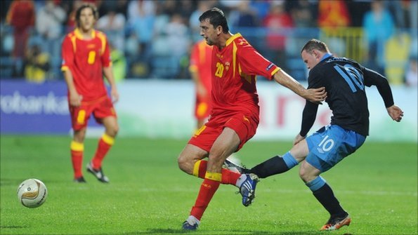Wayne Rooney commits a foul against Montenegro