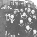 Here is a photograph of me and the other boys in the Orphanage, wearing our sailor uniforms. This was taken in 1940. I am on one knee and the taller of the two at the front.