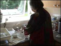 Siu Yu washes up at home 