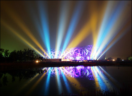 Beijing's Olympic stadium is flooded with light as the one year countdown to the Games begins