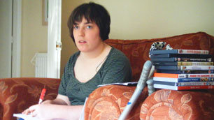 With a pile of DVDs by her side, Nicola looks pensive as she begins the Disability Movie Marathon