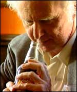 Brian Sewell and beer bottle 