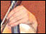 Hand holding a violin