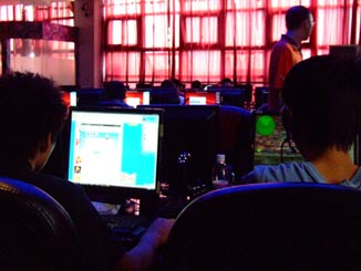 Some people in an internet cafe.