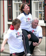 John and Harry carry Elly over the finish line