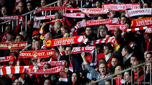 Liverpool fans sing their support during the game in Hungary