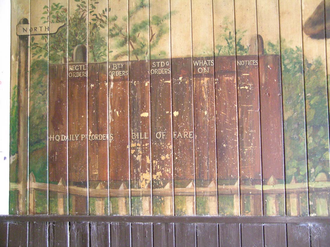 Notice board, including signpost to the north!