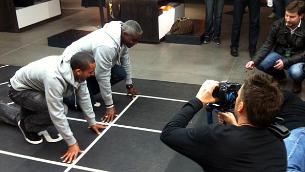 Theo Walcott and Carl Lewis pose for the cameras