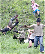 Cheese rollers falling down Cooper's Hill