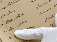 An expert examines a parish burials register