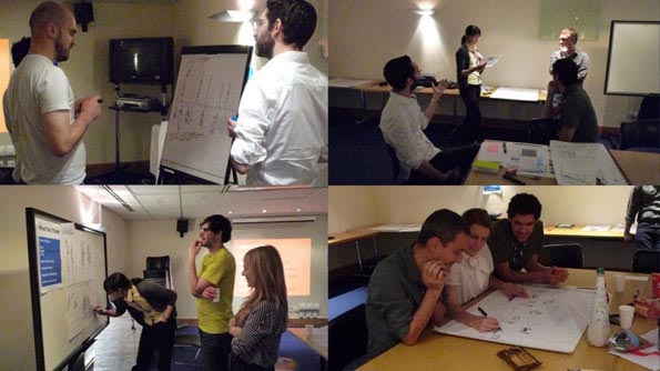 People crowding around whiteboards