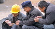 Chines construction worker counting wages