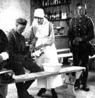 Photo of a World War One nurse tending to a German soldier