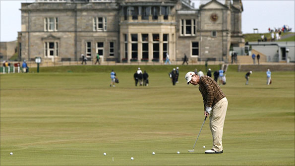 Tom Watson putts on the 17th green during a practice round for The Open.jpg