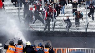 Police fire water at River Plate fans in Buenos Aires.