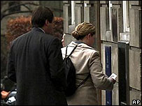 People using a cashpoint
