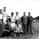Army Camp Open Day 1938. Harry Brooks in physical training kit (squatting centre) and searchlight team. Note the uniform (on right) is still First World War pattern with ‘puttees’, canvas bindings from boots to knees. The searchlight is also First World War vintage.