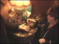 Sarah Petulengro reading a palm