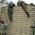 The team scale the wall